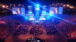 ESL One Cologne 2015 - A bird's eye view of the LANXESS Arena. Production team at the back of the ground floor seating area. Casters on the screens doing pre-match discussions.